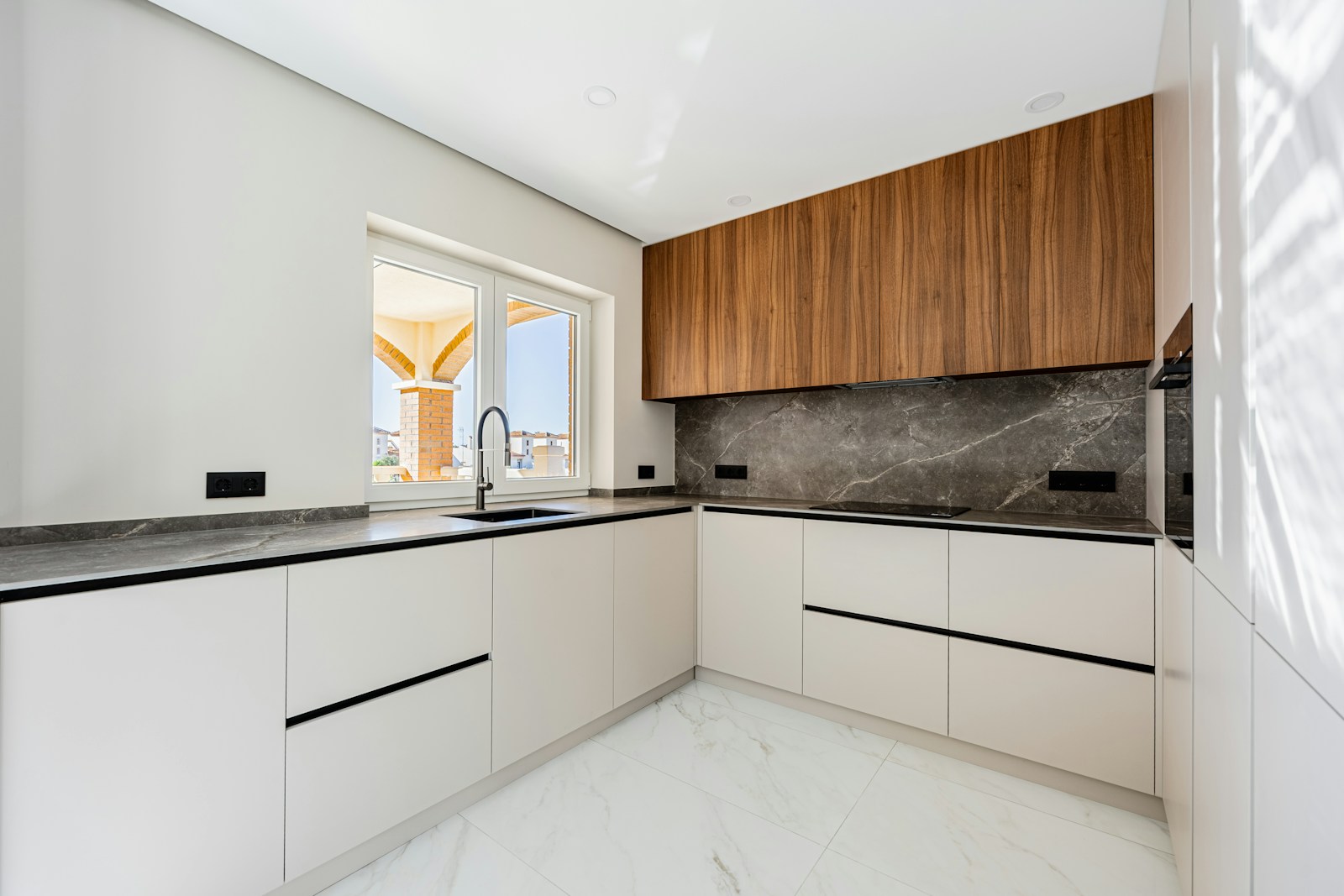 Modern apartment kitchen with wood cabinetry